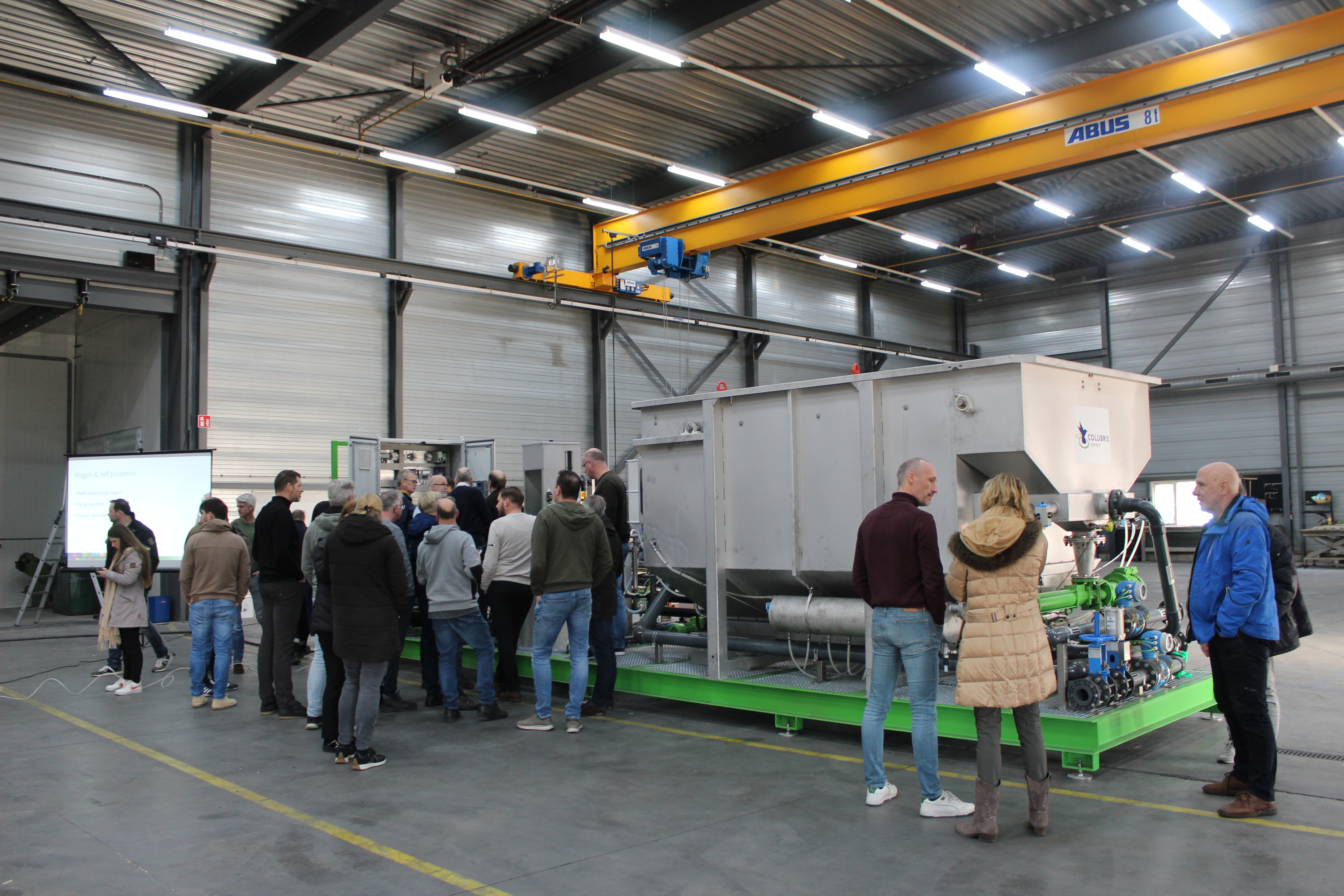 Employees receive an explanation about an innovation during a Lunch & Learn